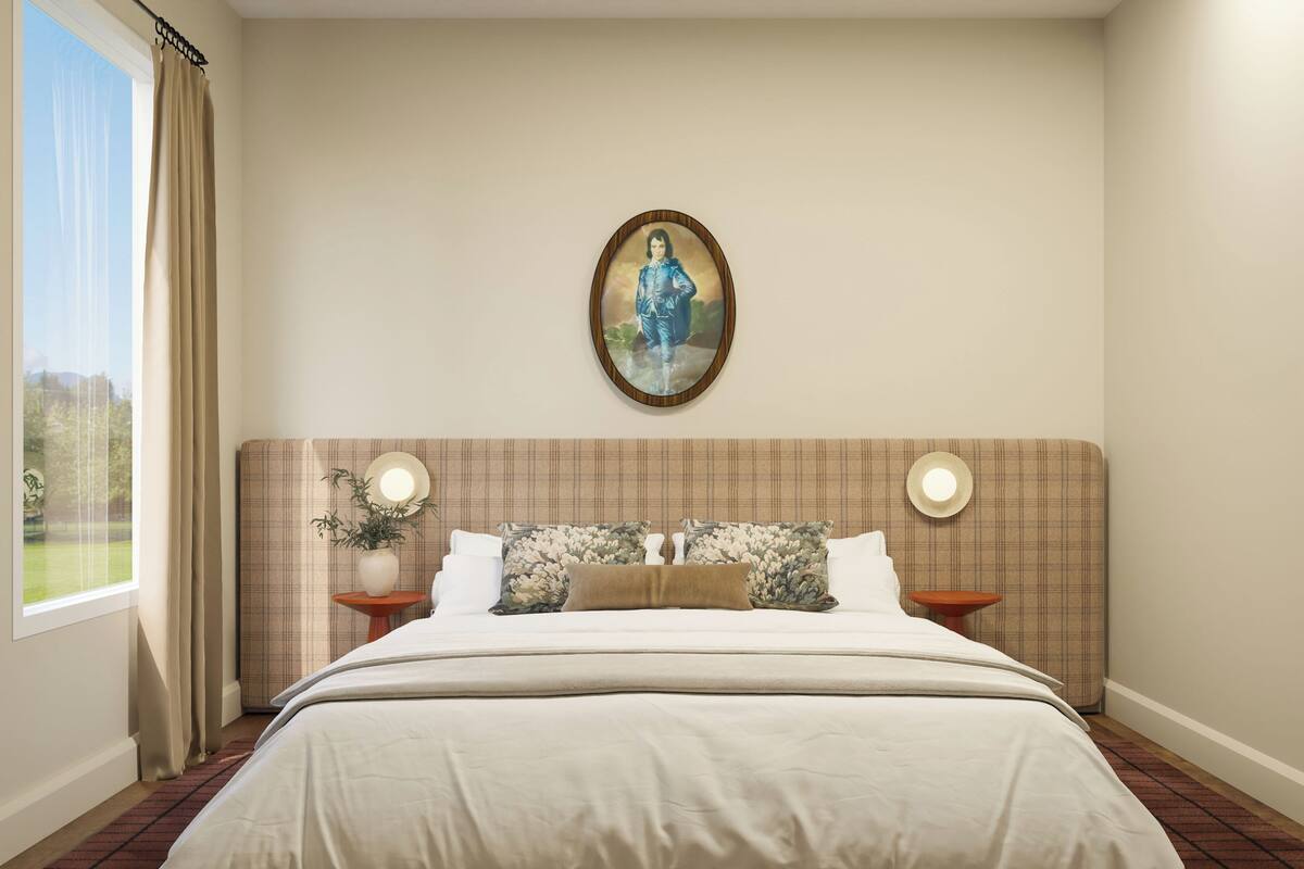A bedroom with a large bed, a headboard with a mirror, two bedside tables, and a window with curtains.