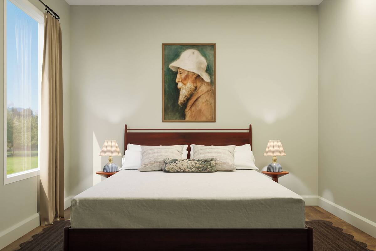 A bedroom with a large bed, two bedside tables with lamps, a painting on the wall, and a view of the outdoors through a window.