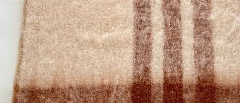 A close-up of a textured fabric with a striped pattern.