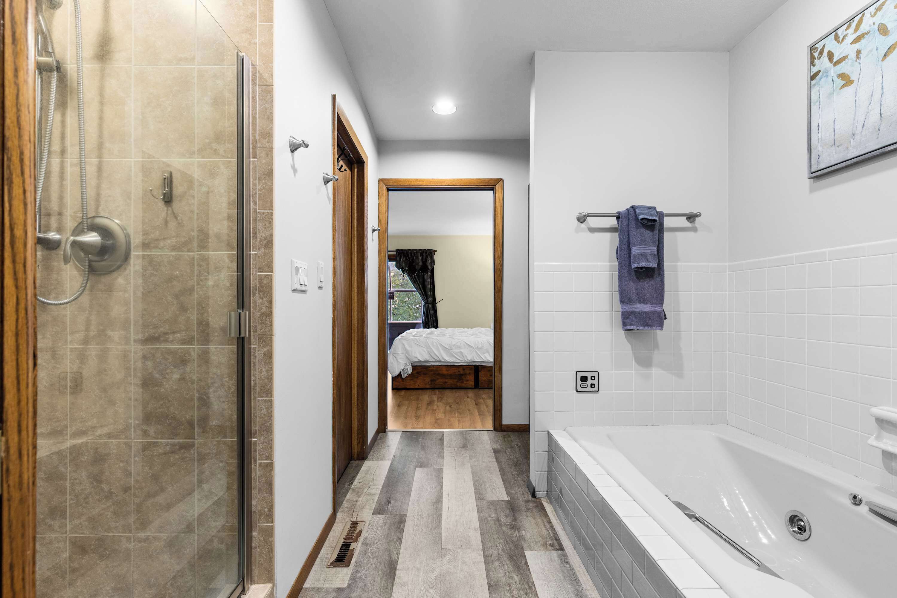 Bathtub, hair dryer, towels, shampoo