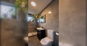 A modern bathroom with a toilet, sink, and shower. - Peaceful + Charming 2 BR Home in Rathmines, Dublin (Dublin 6)