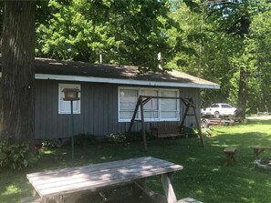 Outdoor dining - Private cabin on serene lake. Small family owned resort. Great fishing lake. (Garrison)