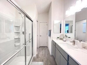 Combined shower/tub, hair dryer, towels, soap