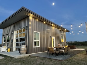 Enjoy a relaxing stay in this charming single-story retreat with a spacious patio and comfortable seating area.
