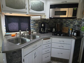 Fridge, microwave, stovetop, coffee/tea maker
