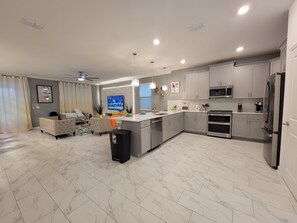 Enjoy a comfortable stay in this apartment with a spacious living area, flat-screen TV, and fully equipped kitchen.