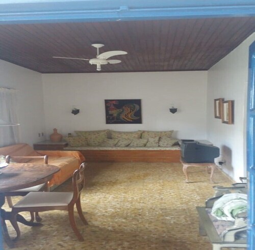 home Beach Center, wooded and grassy yard with fruit trees.