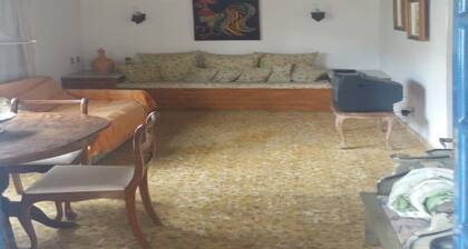 home Beach Center, wooded and grassy yard with fruit trees.