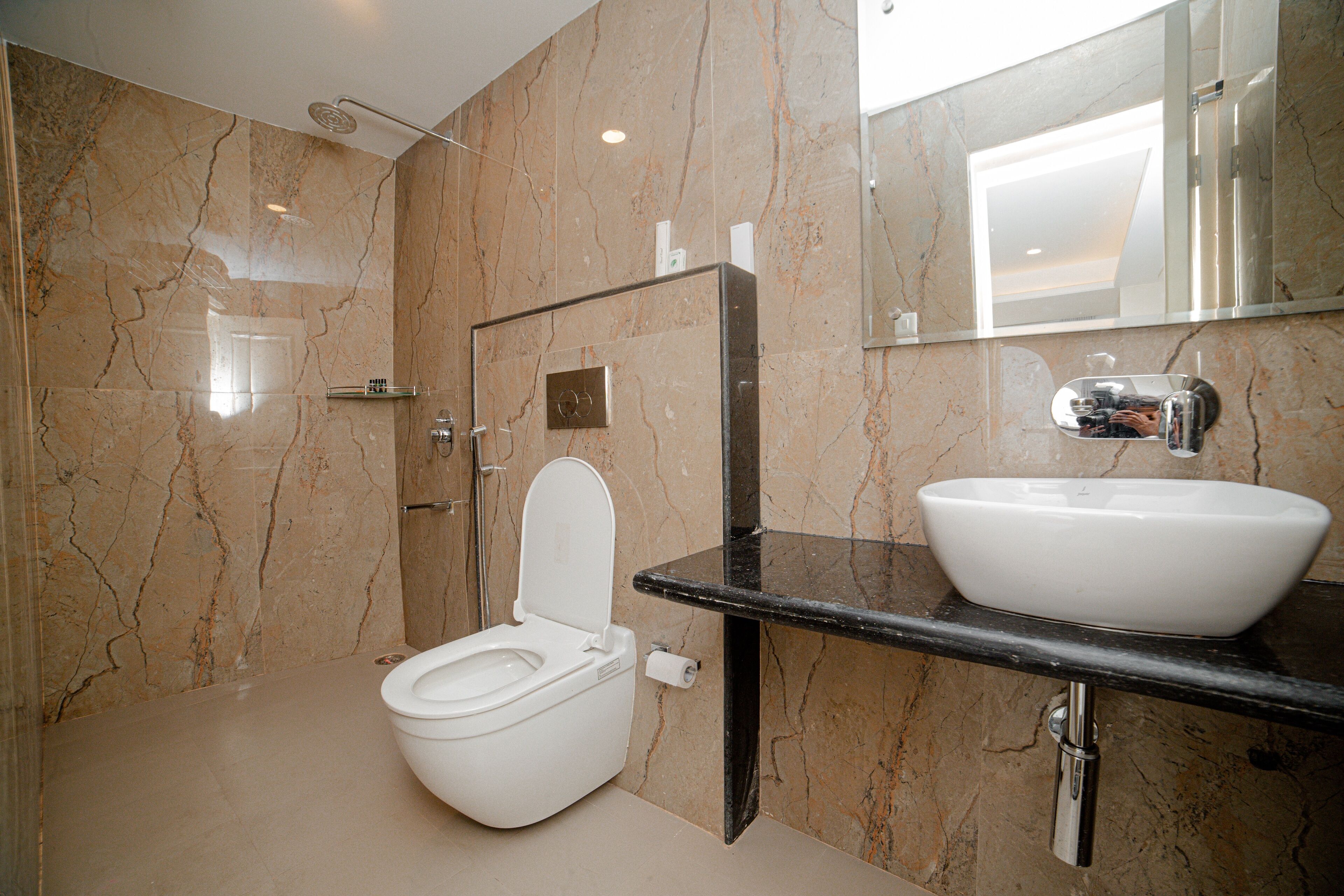 junior studio suite | bathroom | shower, free toiletries, hair dryer, slippers