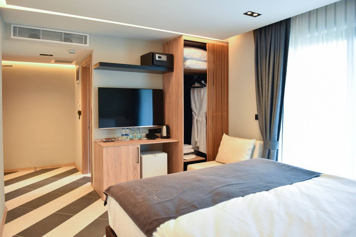 Habitación Deluxe | Ropa de cama de alta calidad y minibar