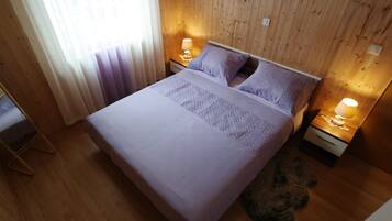 1 bedroom, desk, iron/ironing board, travel crib