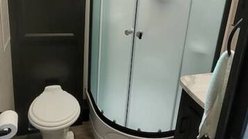 Shower, hair dryer, towels, soap