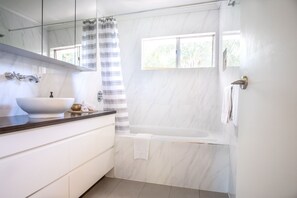 Bathtub, hair dryer, towels
