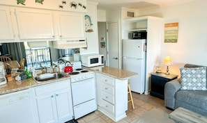 Fridge, microwave, stovetop, coffee/tea maker