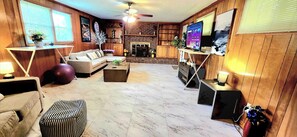 Smart TV, fireplace, books, stereo
