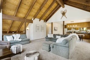 Relax in this inviting living area with a sofa, coffee table, and plush rug.