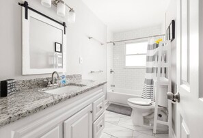Combined shower/tub, hair dryer, towels, soap