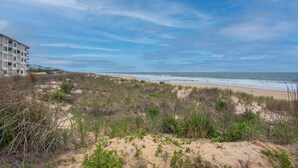 A beach with a building in the background. - Beautiful Ocean views, Just renovated 2 bedroom 2 bath Condo, 2 parking spots  (Ocean City)