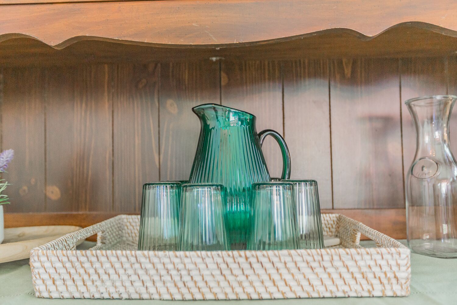 Fully stocked glassware in bar cabinet in living room