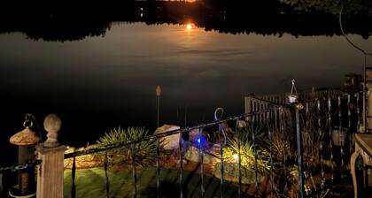 Rustic Lake front cottage nestled in the pines with a Golf Putting Green.