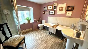 Bathtub, hair dryer, towels, soap