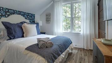 1 bedroom, desk, iron/ironing board, travel crib