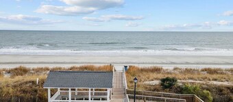 Coastal cottage minutes from the beach.  Large front porch for morning sun!!