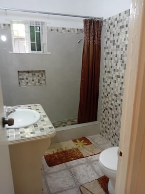 Shower, towels, soap, toilet paper - Cozy Entire home in Spanish Town (Spanish Town)