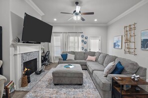 Smart TV, fireplace, books, printers