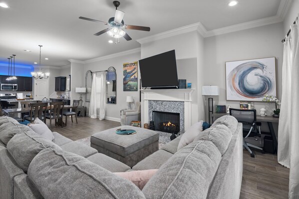 Smart TV, fireplace, books, printers