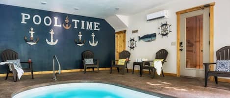 A pool area with a sign reading "POOL TIME" and several Adirondack chairs around the pool.