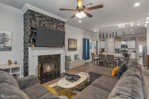 Smart TV, fireplace, books, printers