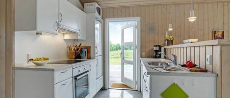 Fridge, stovetop, dishwasher, coffee/tea maker