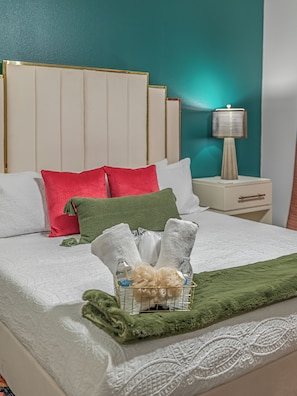 Relax in this inviting room with a large bed, bedside table, and comfortable seating area.