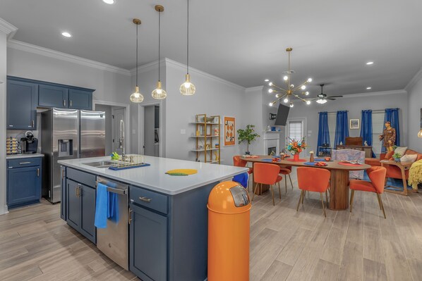 Enjoy cooking in this well-lit kitchen with a central island and sink.