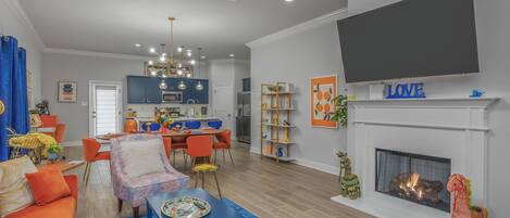 Smart TV, fireplace, books, printers