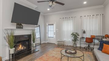 Smart TV, fireplace, books, printers