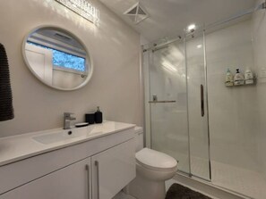 Combined shower/tub, hair dryer, towels, soap