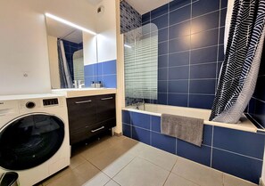 Bathtub, jetted bath, hair dryer, towels