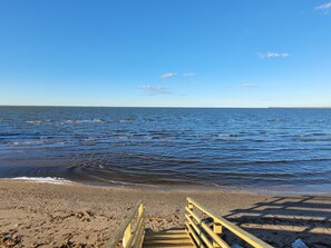 On the beach, sun loungers, beach towels