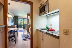 Fridge, microwave, stovetop, coffee/tea maker