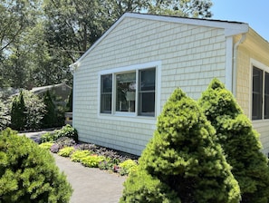 A single-story house with a gabled roof and a front porch.