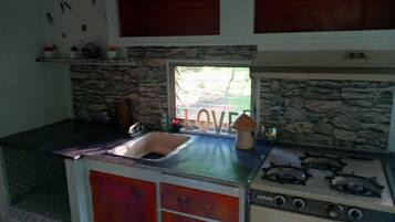 Microwave, coffee/tea maker, toaster, cookware/dishes/utensils