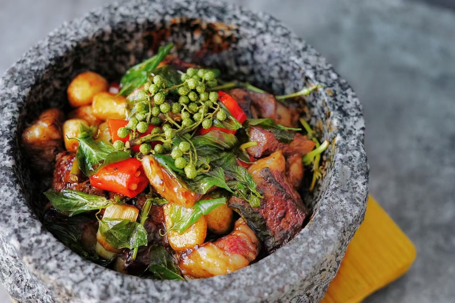 A bowl of food with various ingredients.
