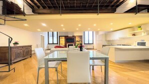 A modern kitchen with white cabinets, a microwave, and a stove. - Central Spoleto 6 Guests apt With Terrace (Spoleto)