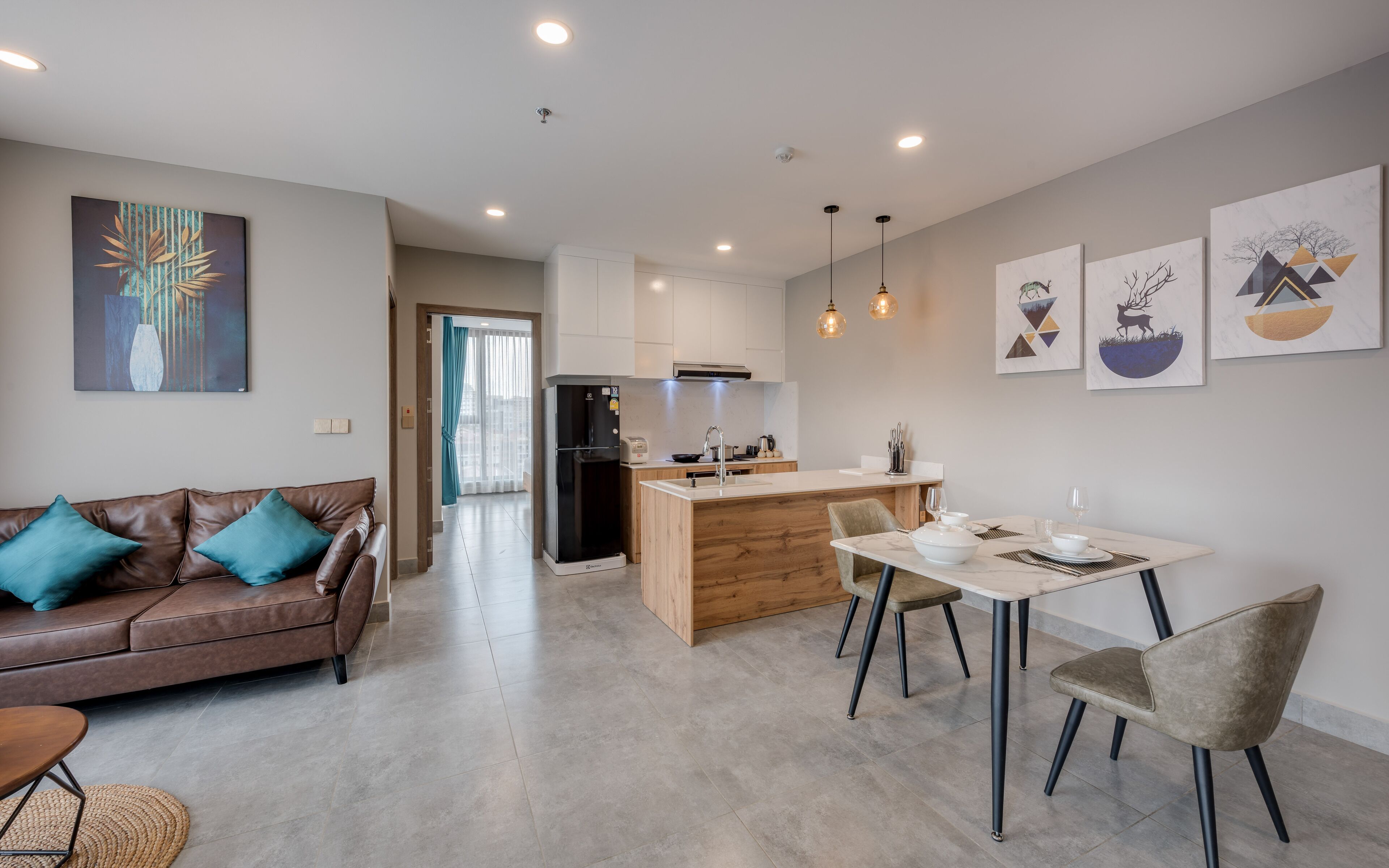 A modern apartment with a living room, dining area, and kitchen.