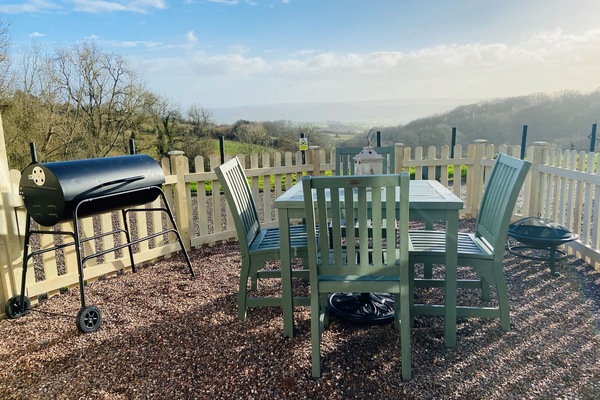 The private garden patio area with Bbq with amazing views over the valley below.