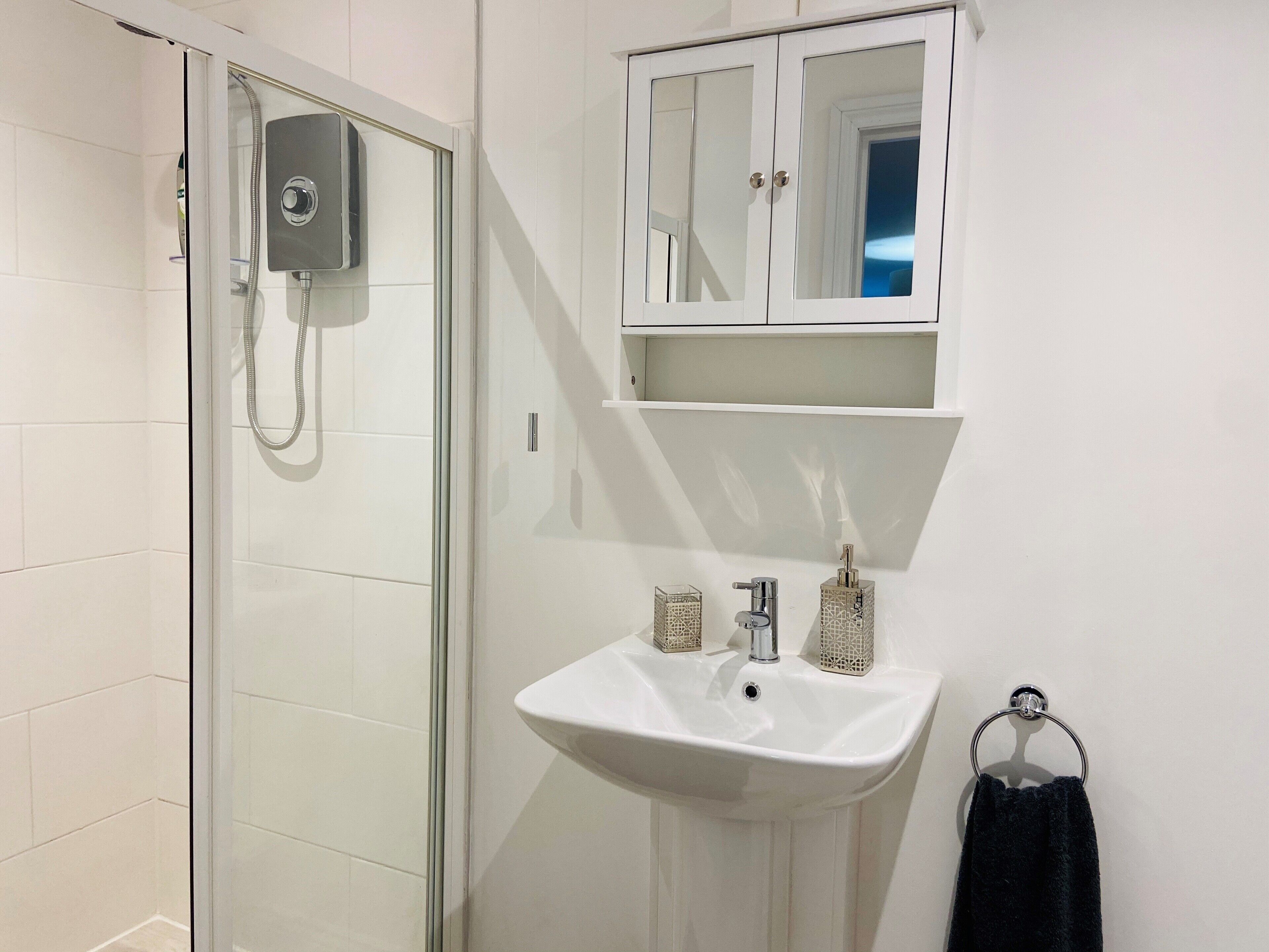 Shower, hair dryer, towels, soap