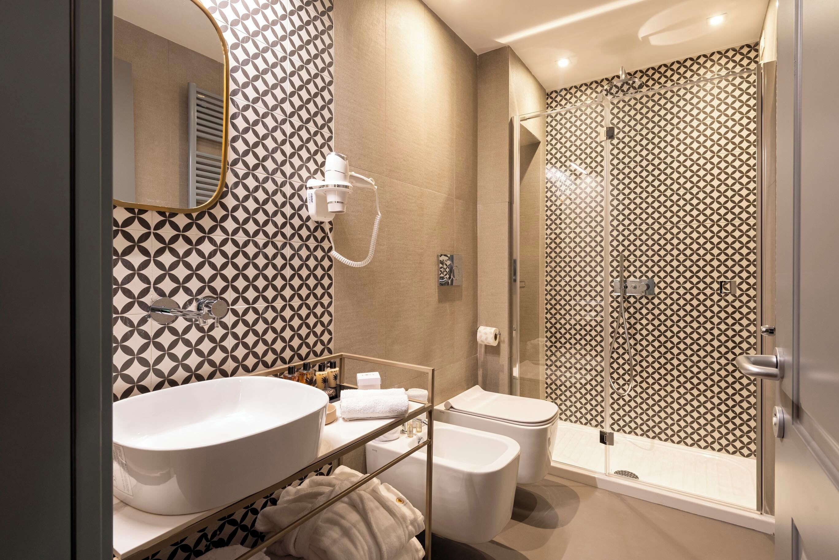 rainfall showerhead, designer toiletries, hair dryer, bathrobes