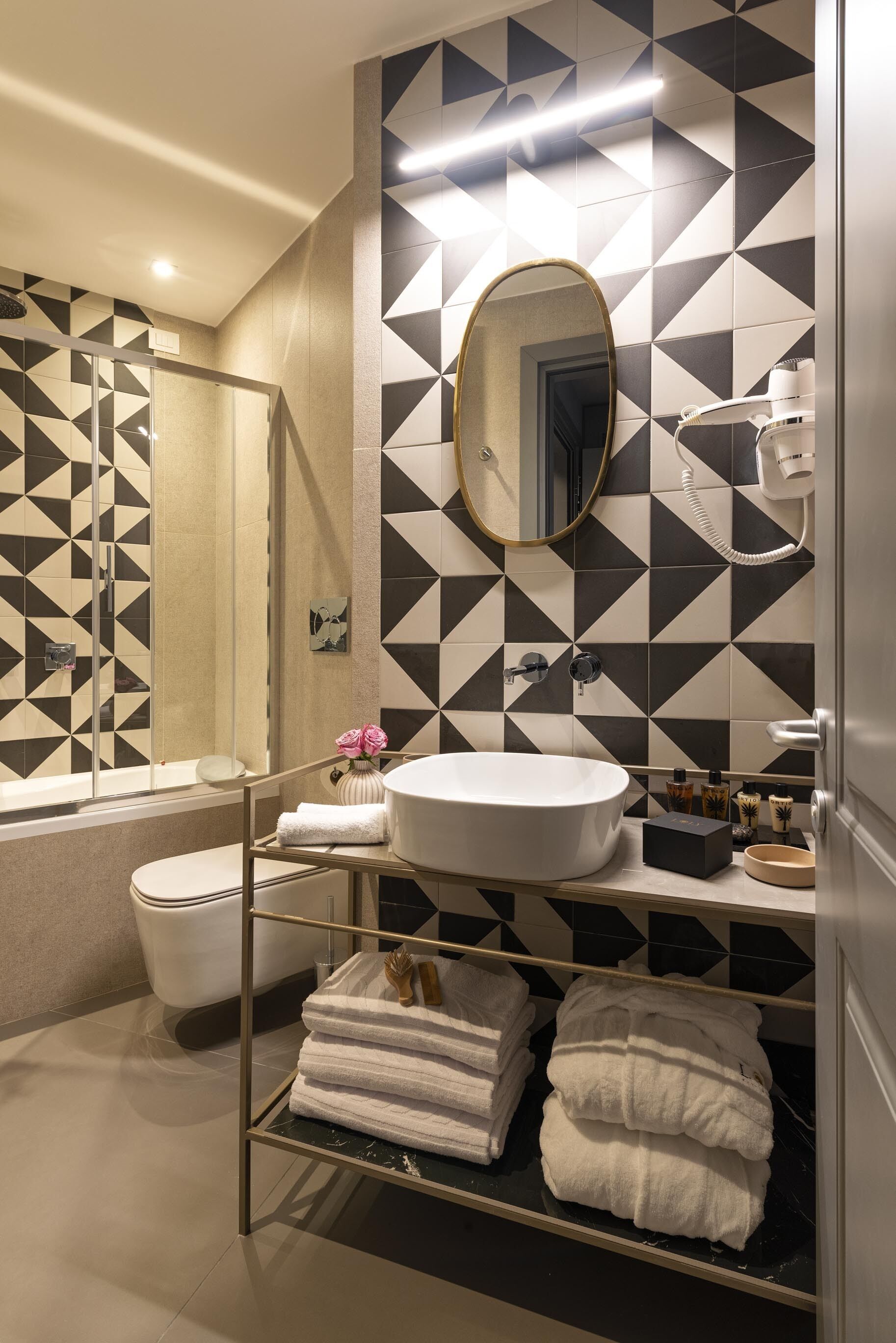 rainfall showerhead, designer toiletries, hair dryer, bathrobes